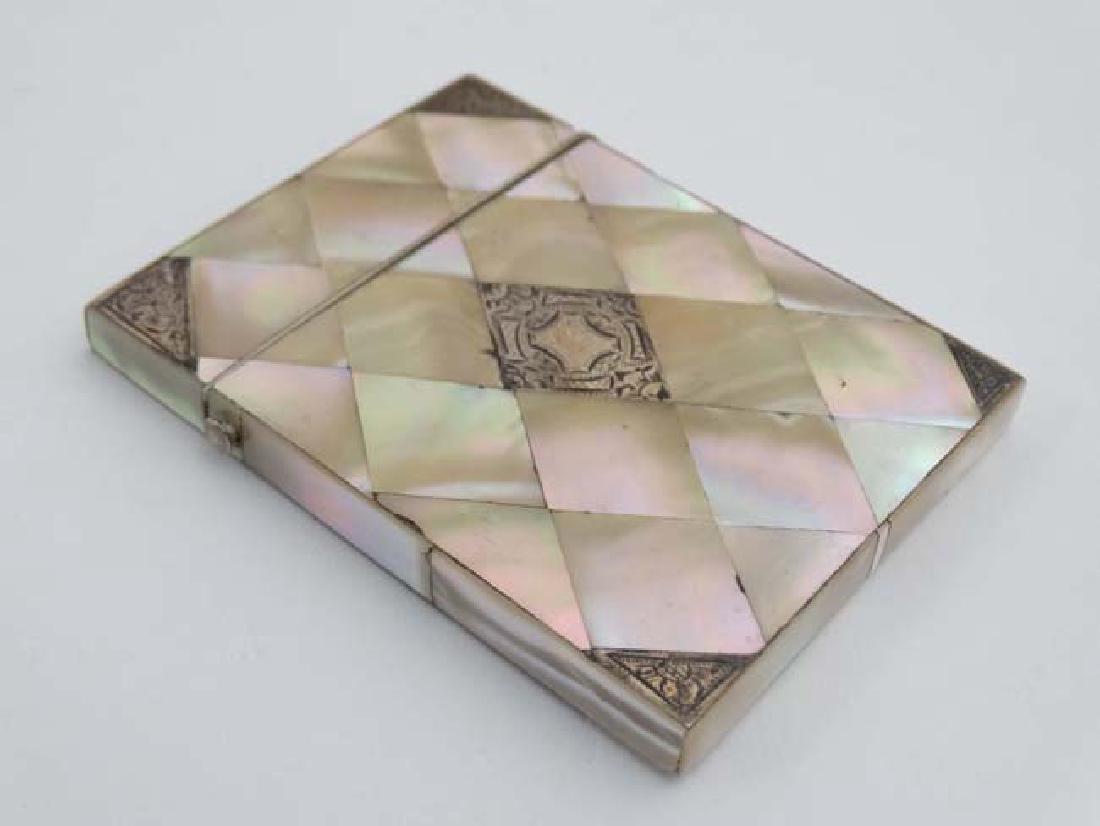 A 19thC mother of pearl, abalone shell and white metal: A 19thC mother of pearl, abalone shell and white metal card case 4'' high x 3'' wide