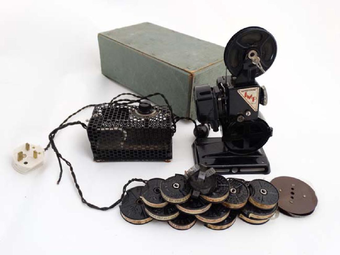 A 1930s boxed Pathescope Imp P.222 9.5mm projector ,: A 1930s boxed Pathescope Imp P.222 9.5mm projector , together with a quantity of films to include ' Charlie the Watchmaker ' , ' Negretina's Welfare Centre ' , ' Fur and Feathers ' , ' Mickey's Follie