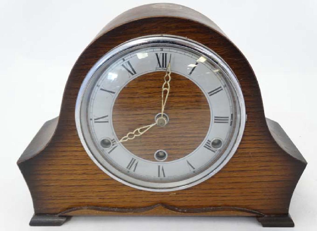 3 Train Oak Mantle Clock : a 'Perivale ' oak cased 3: 3 Train Oak Mantle Clock : a 'Perivale ' oak cased 3 train Westminster Chime oak cased mantle clock with ' Strike - Silent ' at 3 , ' Bentima ' Chapter ring with Roman numerals measuring 11 1/2'' wide