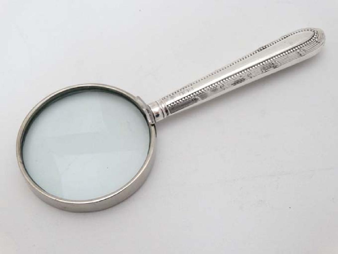 A silver handled magnifying glass, the whole 5 1/2'' (1 of 4)