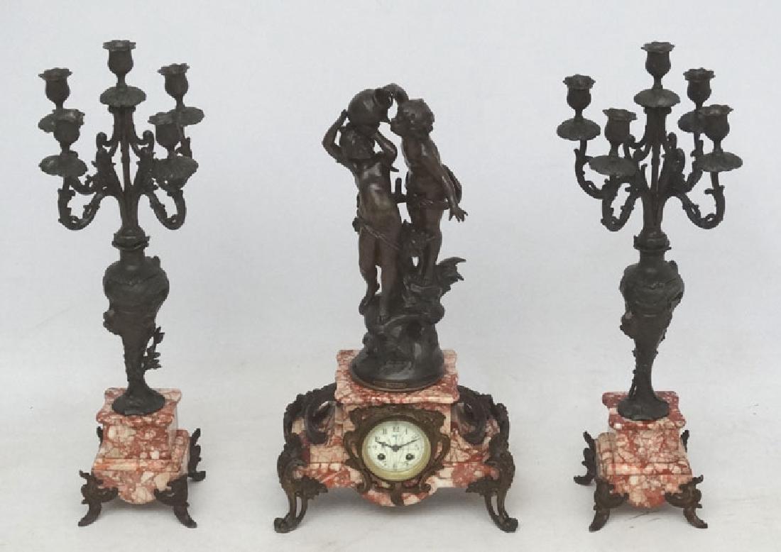 French clockset with candlesnuff : a breccia type: French clockset with candlesnuff : a breccia type marble 3 piece Clock set with bronze like spelter fiinsh , bronzed spelter after Aug Moreau called ' Douce Ivresse ' having 2 x 5 branch garnitures fl