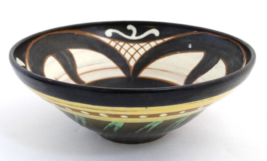 Scandinavian Pottery: An early/mid 20thC Upsala Ekeby ,: Scandinavian Pottery: An early/mid 20thC Upsala Ekeby , Sweden bowl, numbered 2052, decorated in black and brown on a cream ground, bears factory mark to base. 10 1/4'' diameter.
