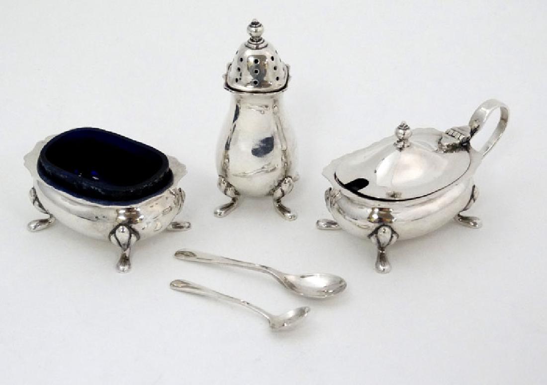 A silver three piece cruet set comprising salt pepper (1 of 8)