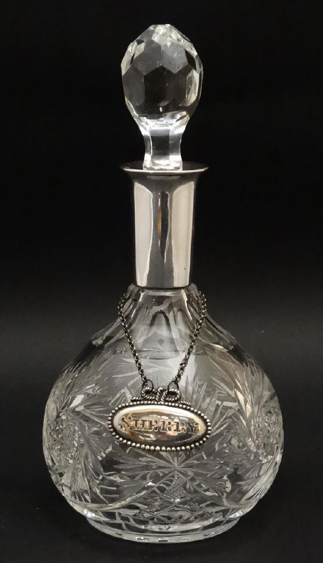 A glass decanter with sterling silver collar  together (1 of 5)