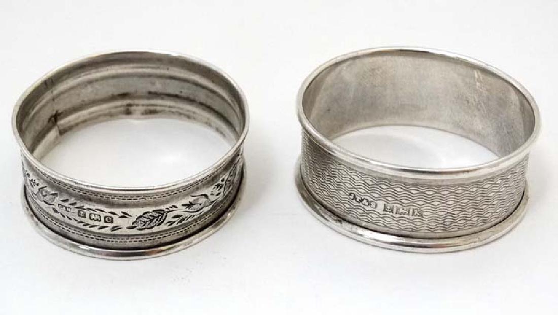 Two silver napkin rings one hallmarked Birmingham 1902: Two silver napkin rings one hallmarked Birmingham 1902 maker Crisford & Norris, the other hallmarked Birmingham 1959 maker John Thompson & Sons. (2) (18g)