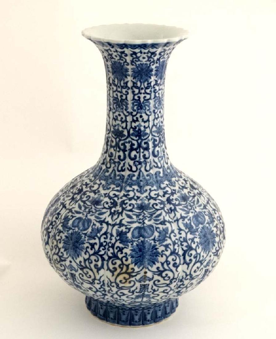A Chinese Blue and white flared rim bottle vase of (1 of 4)
