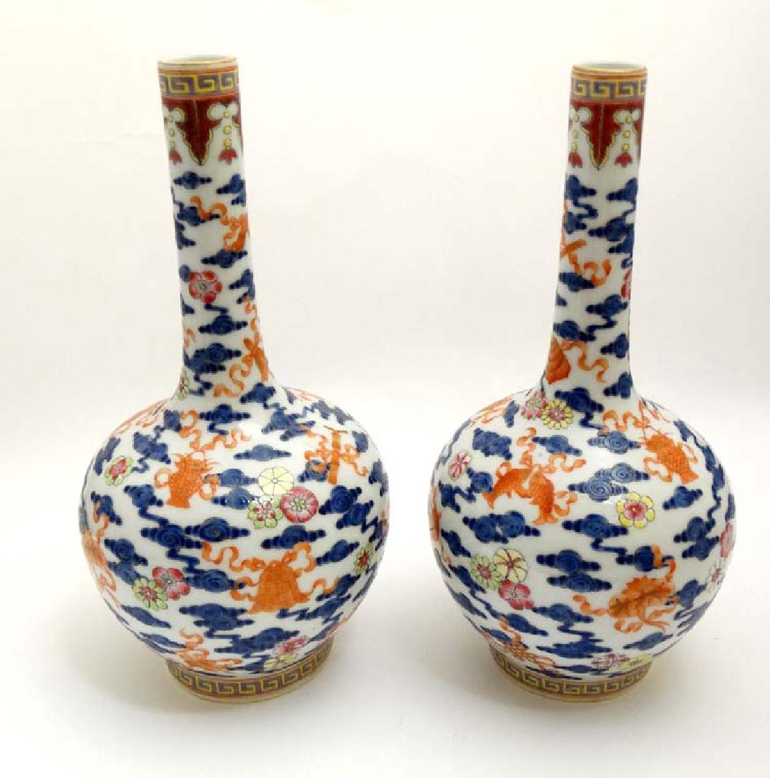 A pair of Chinese blue and white bottle vases decorated (1 of 8)
