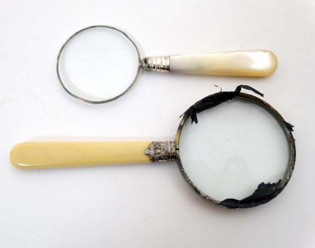Two magnifying glasses. The largest 2 1/2'' diameter: Two magnifying glasses. The largest 2 1/2'' diameter