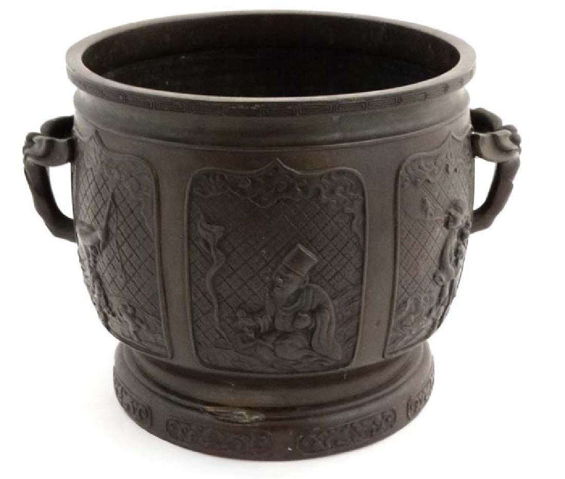A Chinese cast bronze jardiniere with 6 decorative (1 of 6)