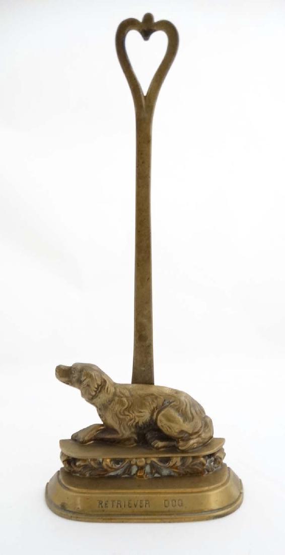 Late Victorian cast brass dog door stop / door porter: Late Victorian cast brass dog door stop / door porter with the wording ' Retriever Dog ' to base , measuring 15'' high