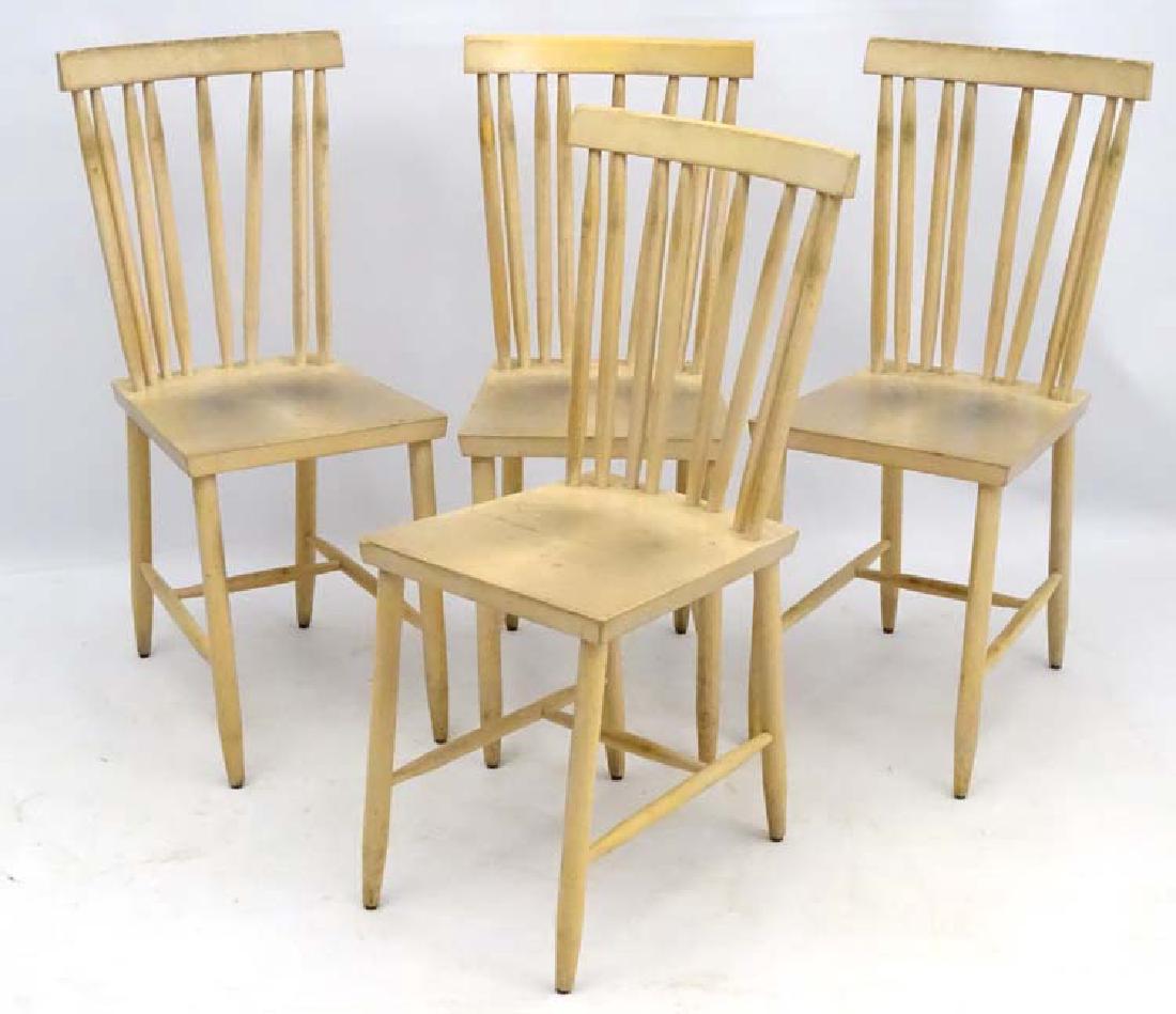 Vintage Retro : a set of 4 modern design chairs (By: Vintage Retro : a set of 4 modern design chairs (By Design house) in the Ercol style , blonde wood with flattened stick backs and shaped top rails , measuring 34'' high.