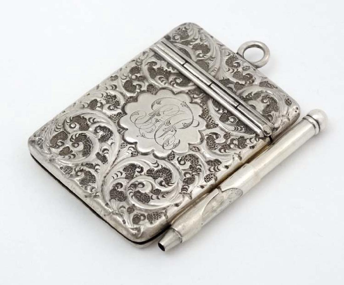 A silver aide de memoir / miniature notebook with (1 of 4)