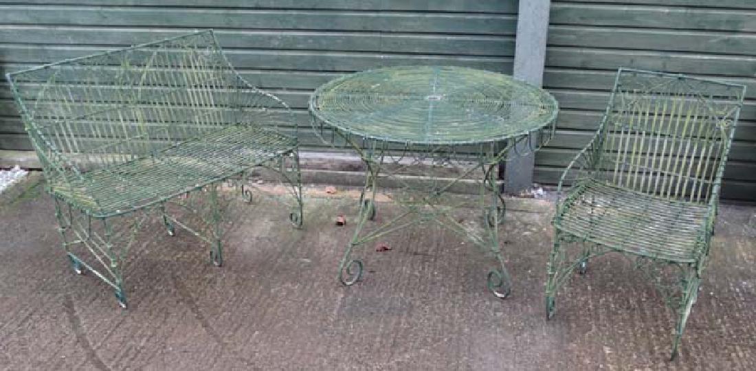 Architectural / Garden Salvage : a French style: Architectural / Garden Salvage : a French style wirework Bistro single armchair , circular table and two seat armchair / bench, the table measuring 40 1/2'' diameter x 30'' high.