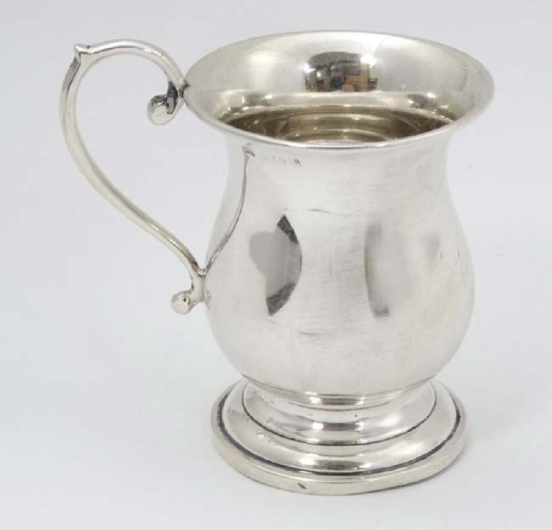 A silver Christening mug hallmarked Birmingham 1945: A silver Christening mug hallmarked Birmingham 1945 maker Bishton's Ltd. 3 1/2'' high (68g)