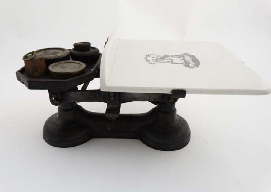 An Edwardian set of balance scales with ceramic stand (1 of 9)
