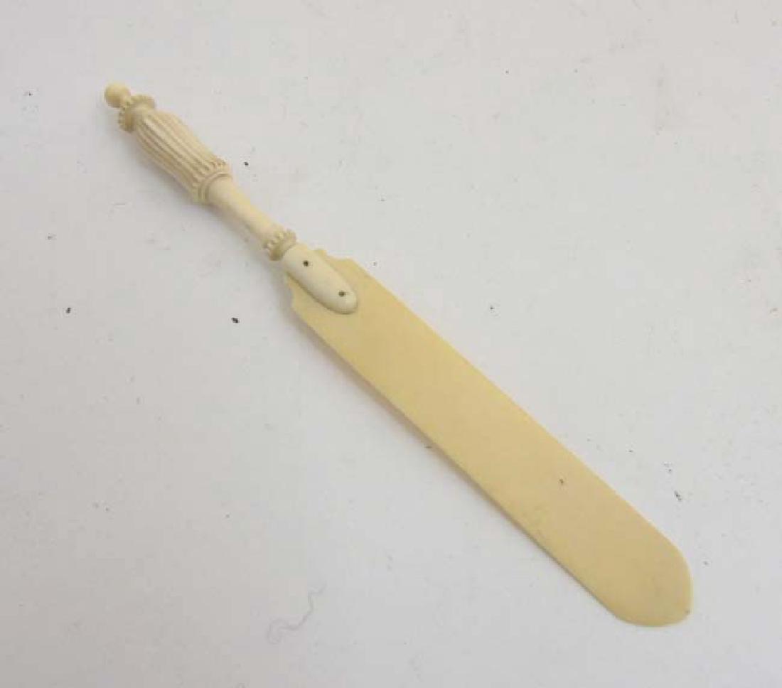 An Edwardian carved ivory paperknife with turned and (1 of 5)