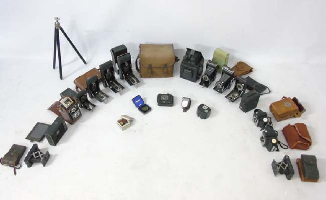 A collection of early to mid 20thC Cameras and: A collection of early to mid 20thC Cameras and associated equipment , to include examples by Kodak ( Cresta Brownie , Vest Pocket Autographic , Autographic , Brownie 127 ) and Ensign ( Pocket 20 , Fol