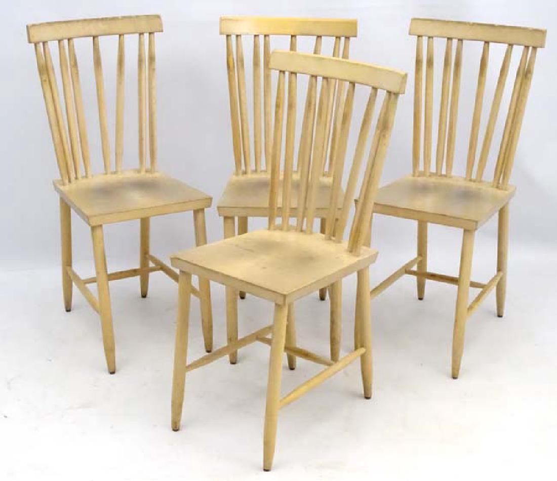 Vintage Retro : a set of 4 modern design chairs (By: Vintage Retro : a set of 4 modern design chairs (By Design house) in the Ercol style , blonde wood with flattened stick backs and shaped top rails , measuring 34'' high.