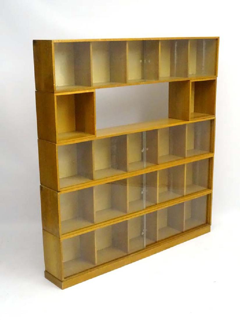 Vintage Retro : UNIX from Pheonix Gallery glazed: Vintage Retro : UNIX from Pheonix Gallery glazed front ( sliding doors) bookcase / display shelving units ( 7 x 5 sectional )and (5 x 1 sections which are just open) , solid blond oak , many marked wi