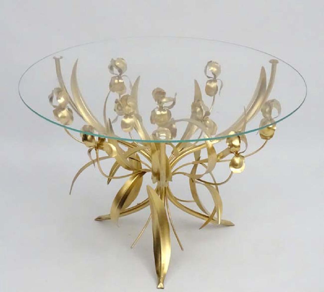 Vintage Retro : Follower of Coco Chanel , a gilt tole: Vintage Retro : Follower of Coco Chanel , a gilt tole iris side table in the Wheatsheaf style with circular glass top and measuring 31'' diameter x 20 1/2'' high