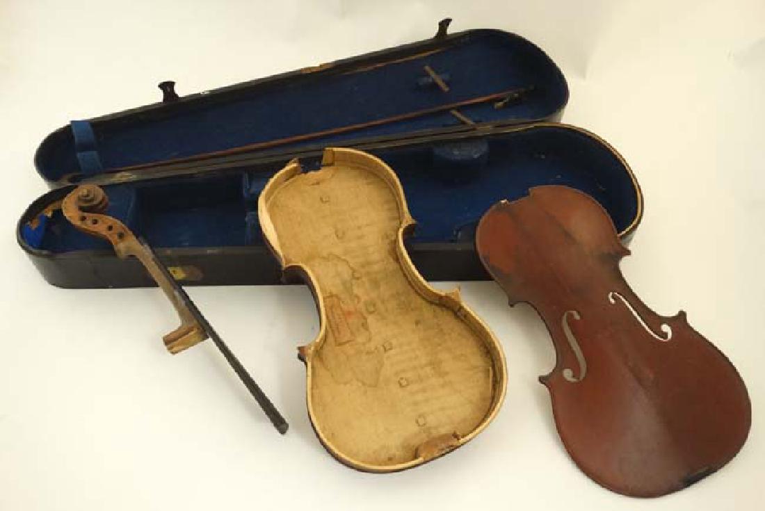 Musical Instruments : A Victorian Violin Case ,: Musical Instruments : A Victorian Violin Case , together with bow and the major parts of a c1900 violin , the body bearing label for JTL Mansuy a Paris . The case 30 1/4'' long