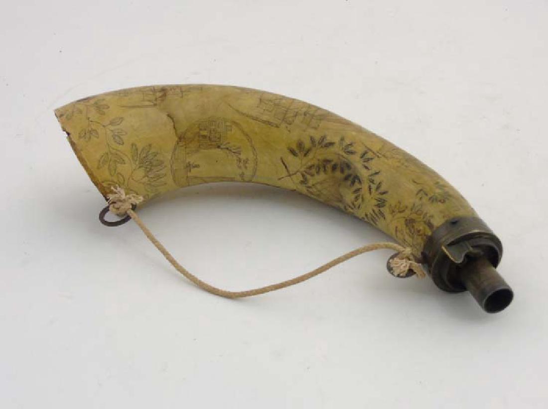 19 thC. Scrimshaw :an English cow horn Powder Horn with: 19 thC. Scrimshaw :an English cow horn Powder Horn with incised images of an early steam train and carriages , three ships all flying the British Ensign , buildings and heart motif , approximately 10