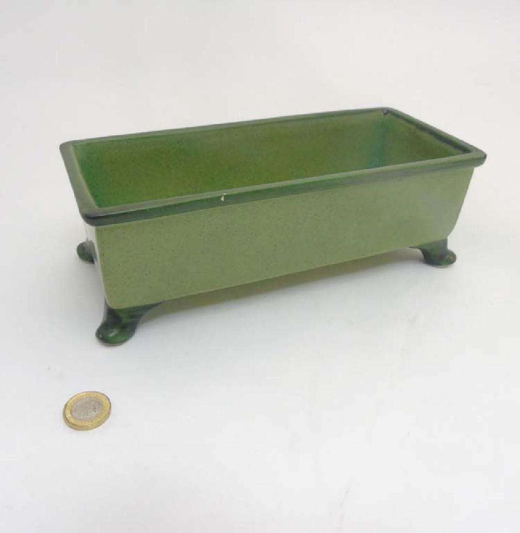 Scandinavian Pottery: A Retro Swedish Bo Fajans four: Scandinavian Pottery: A Retro Swedish Bo Fajans four footed flower bough decorated in green glaze, makers mark to base, 10'' long, 4 1/4'' wide, 3 1/2'' high