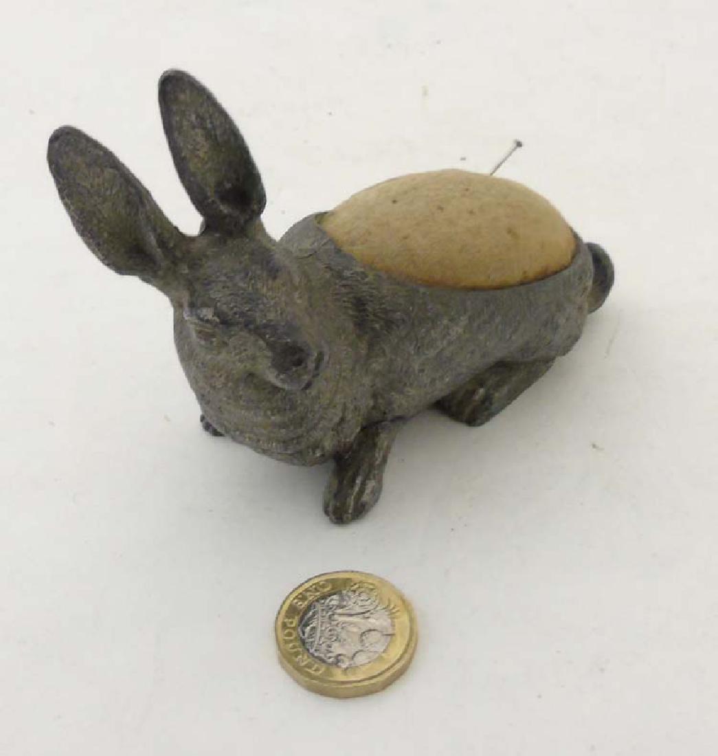 A late Victorian novelty pin cushion formed as a nickle (1 of 6)