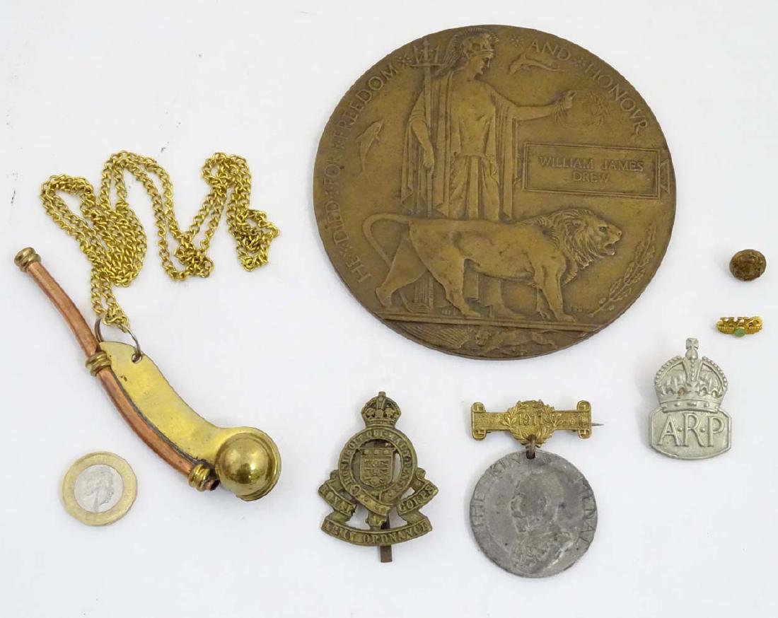 Militaria: An assortment of 20thC items , comprising a: Militaria: An assortment of 20thC items , comprising a bronze WWI death plaque (William James Drew), WWII ARP lapel badge, RAOC cap badge, Bosun's whistle, King's medal for attendance, 'WK' service la