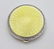 A silver powder compact with yellow guilloche enamel