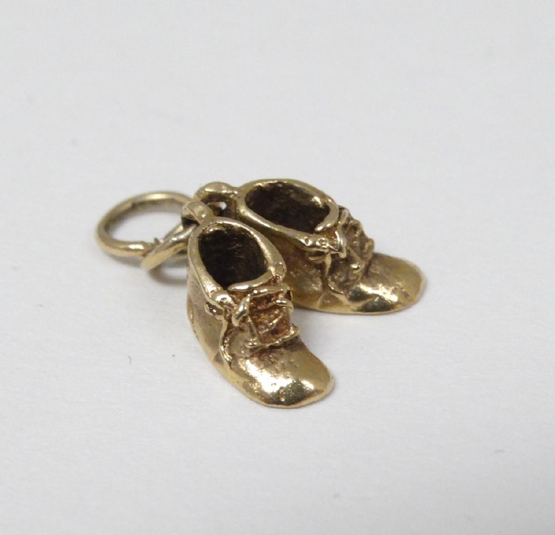 A 9ct gold charm / pendant formed as miniature pair of (1 of 6)