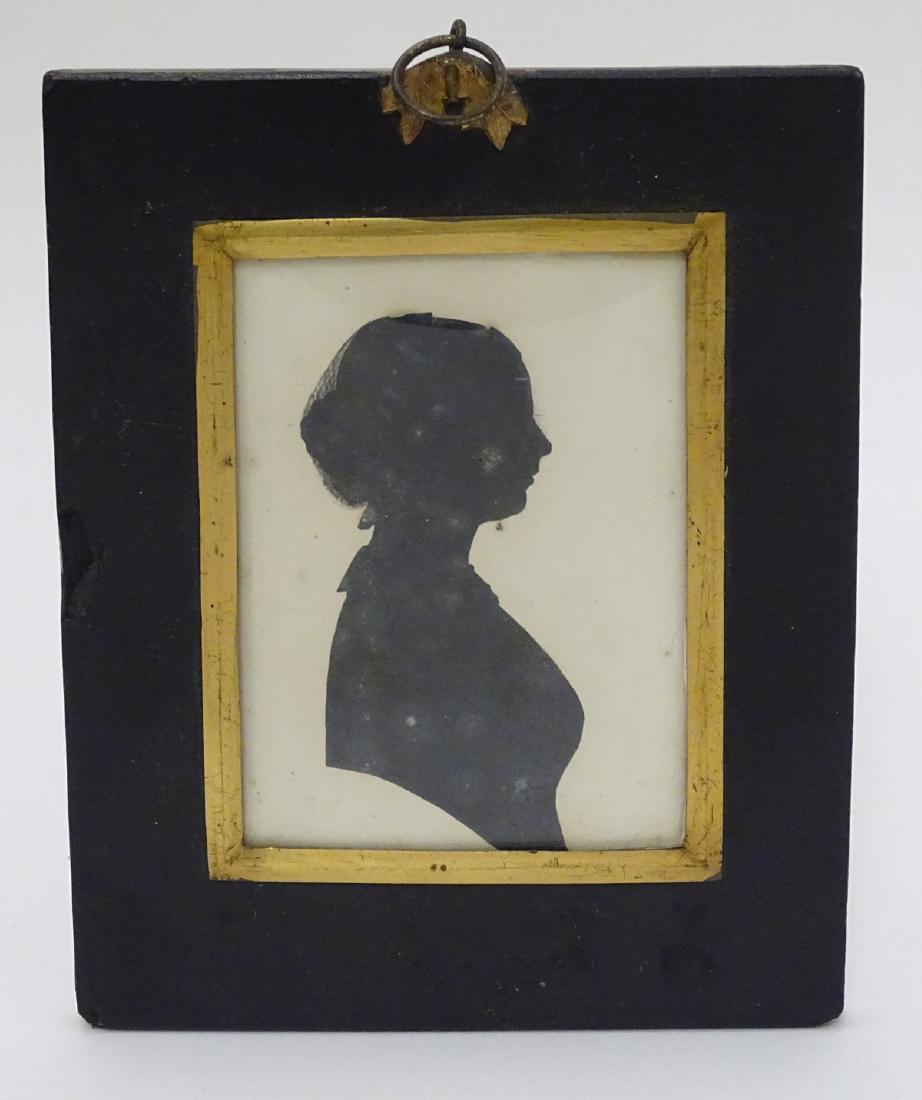 Silhouette : a painted monochrome silhouette , a bust: Silhouette : a painted monochrome silhouette , a bust portrait looking right , entitled AMC Goluestone ' verso , in a bowed glass frame , measuring 4 x 3'' in an ebonised frame with foliate hanger.