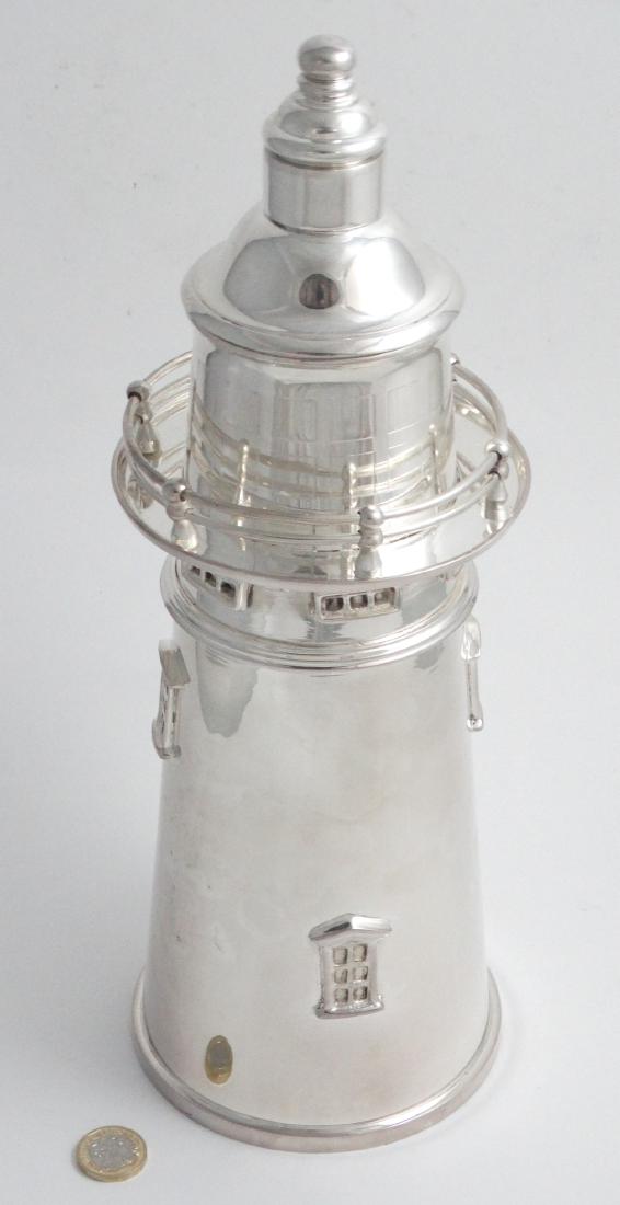 A novelty silver plate cocktail shaker formed as a (1 of 7)