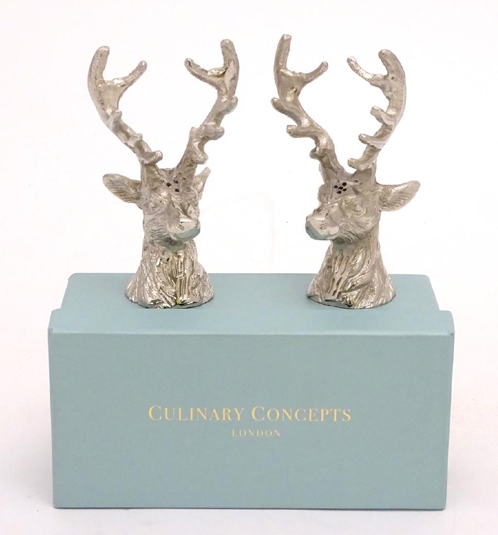 A Culinary Concepts cruet set in the form of stag: A Culinary Concepts cruet set in the form of stag heads, with original box, approx. 5 1/2'' high.