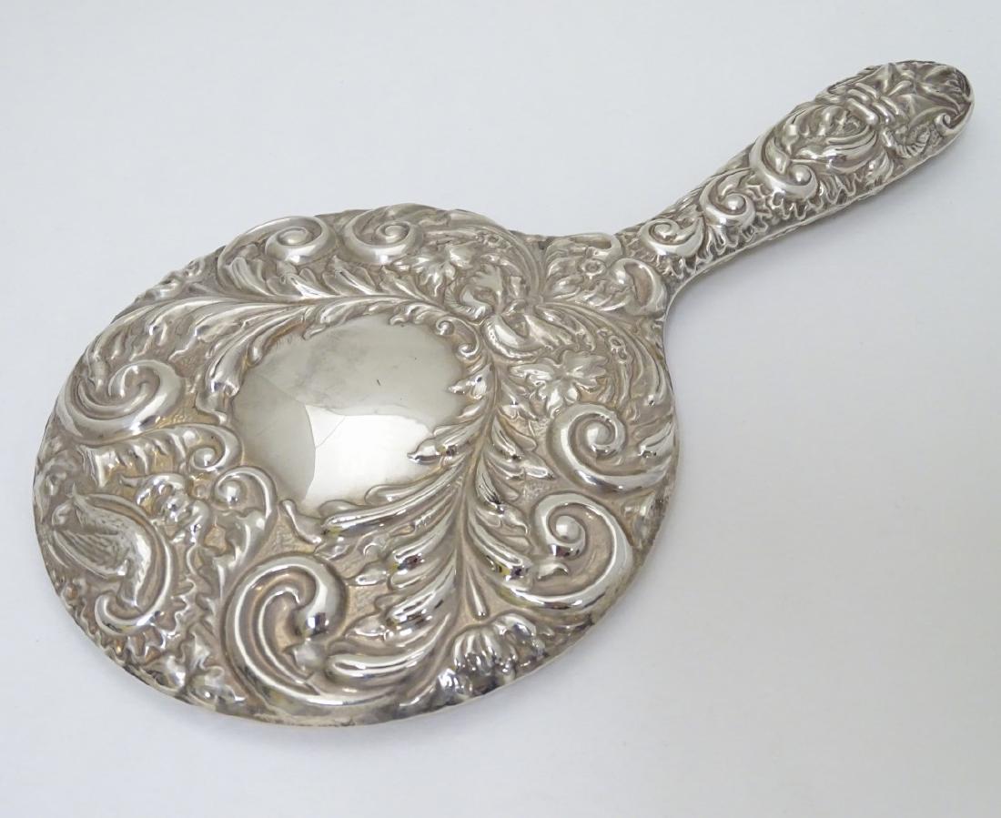 A silver hand mirror hallmarked Birmingham 1969 9 1/4'': A silver hand mirror hallmarked Birmingham 1969 9 1/4'' long