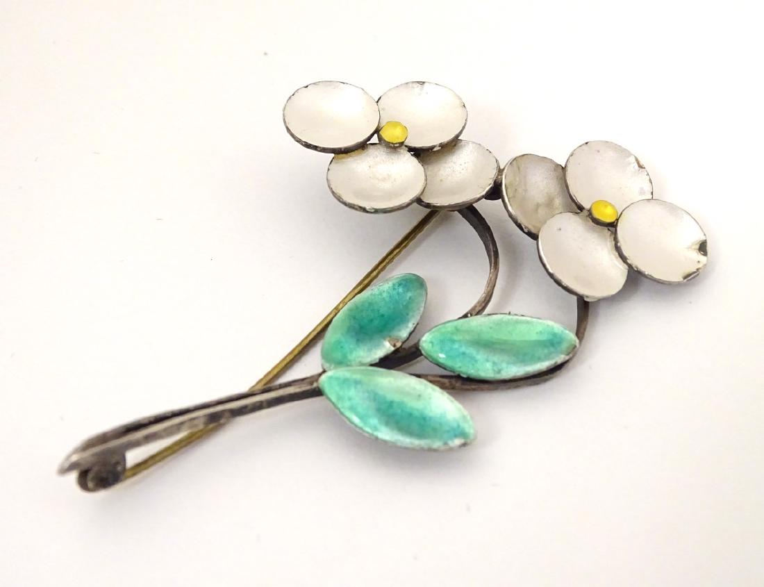 Bernard Instone : An silver flower brooch with enamel: Bernard Instone : An silver flower brooch with enamel decoration. Marked Silver BI. Approx 2 3/4'' long