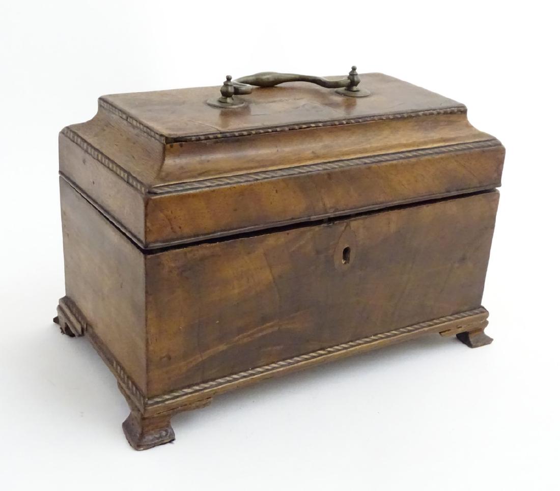 An 18thC mahogany tea caddy on ogee feet and opening to: An 18thC mahogany tea caddy on ogee feet and opening to reveal 3 tin containers within. 10 1/4'' x 5 1/4'' x 6 1/2''