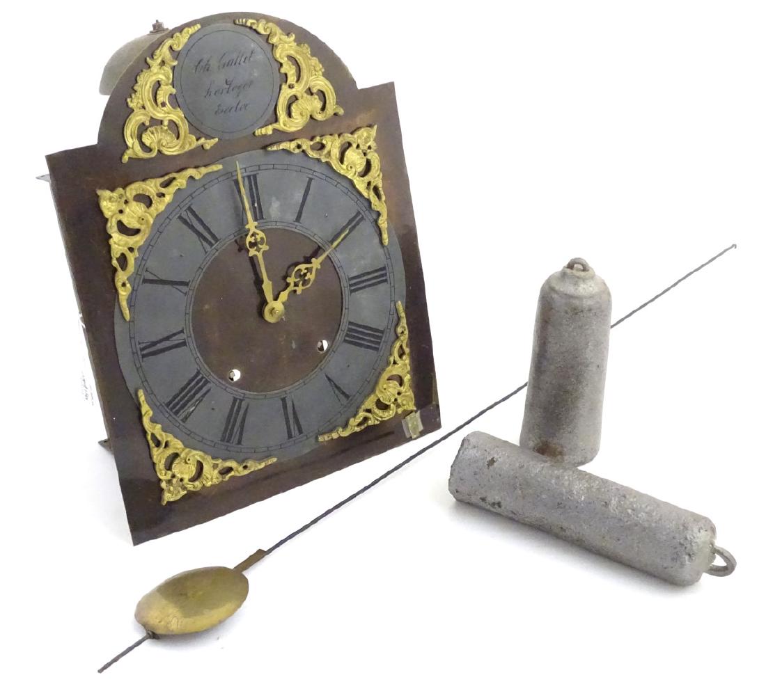 CH Gallet , Horloger Eecloo :( Belgian ) a Continental: CH Gallet , Horloger Eecloo :( Belgian ) a Continental wall clock, signed , with 12 1/4'' breakarch dial , 8 day weight driven movement striking on a large bell with brass hands and cast spandrels etc