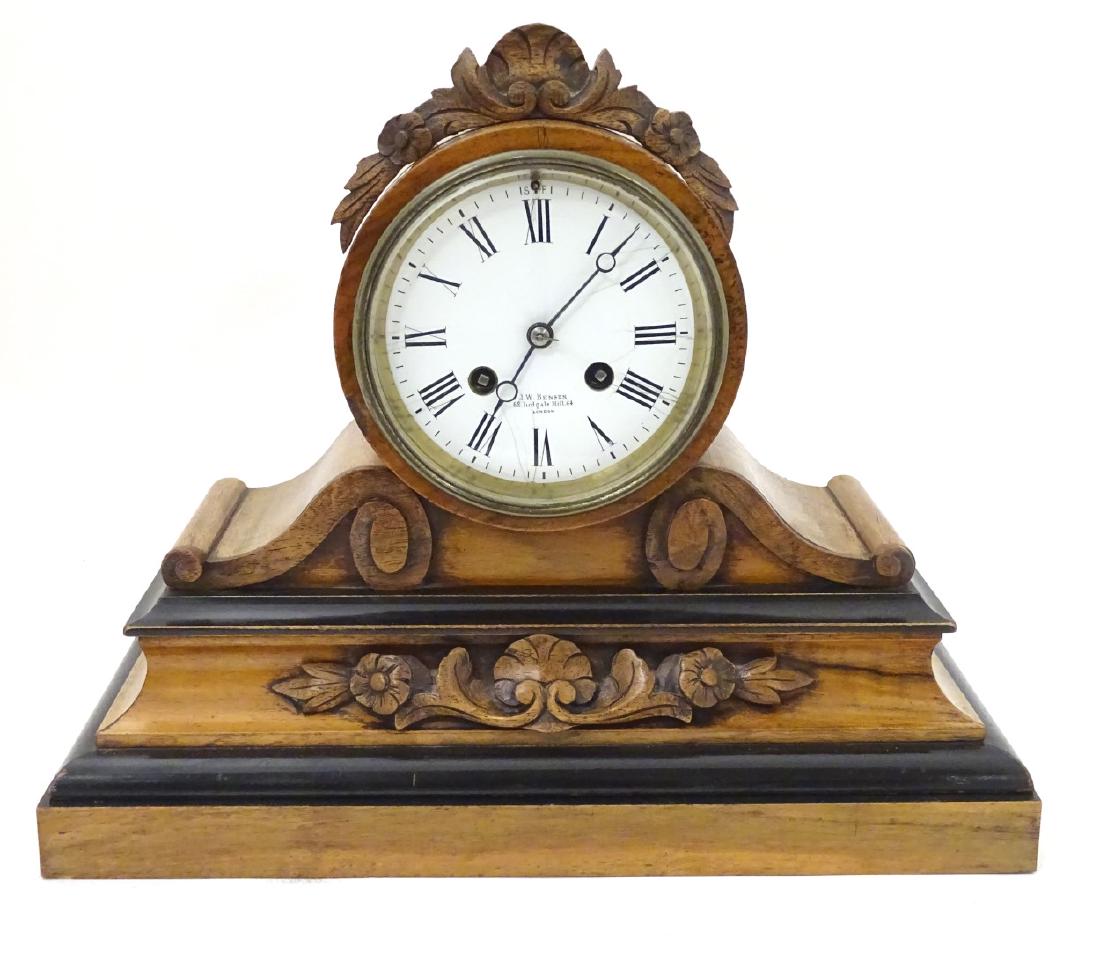 J W Benson Drumhead mantel clock : a Victorian walnut 8: J W Benson Drumhead mantel clock : a Victorian walnut 8 day Drumhead mantle clock , with porcelain dial signed ' JW Benson , 62 Ludgate Hill 64 , London ' the movement striking on a bell , with outsid