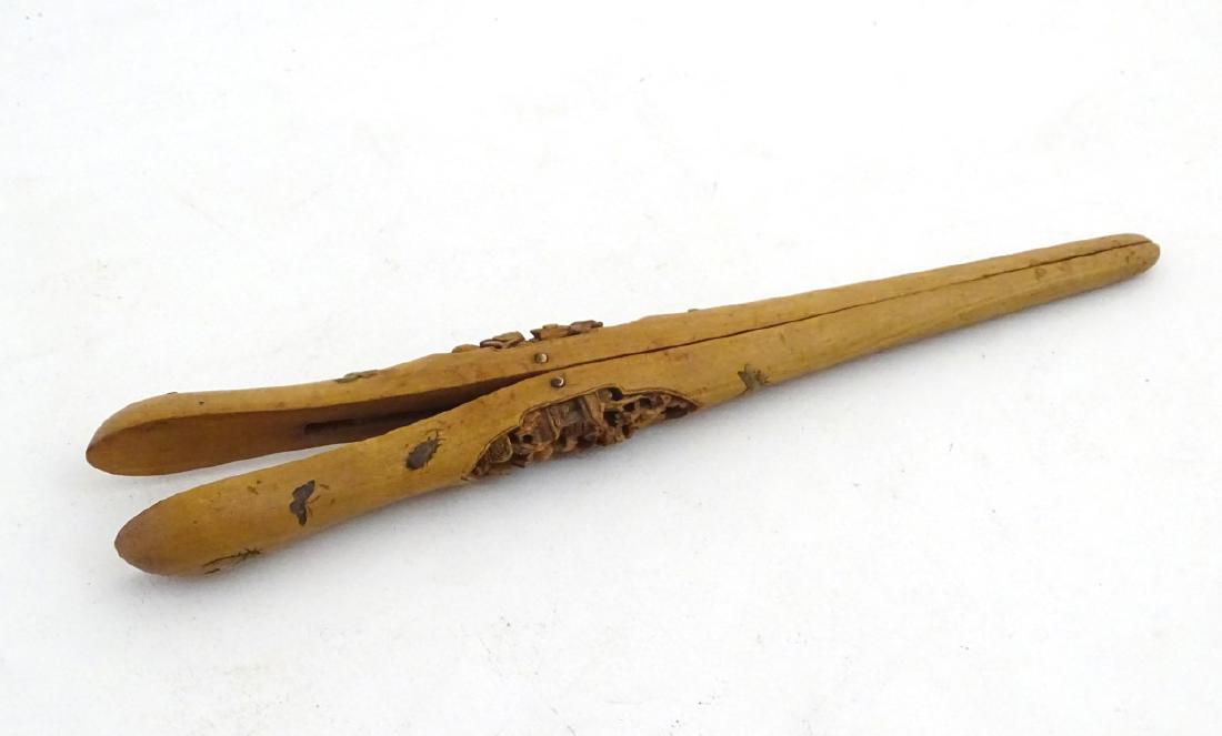 A Japanese Shibayama decorated carved wooden glove: A Japanese Shibayama decorated carved wooden glove stretchers decorated with semi precious stones and carved detail. 10 1/4'' long
