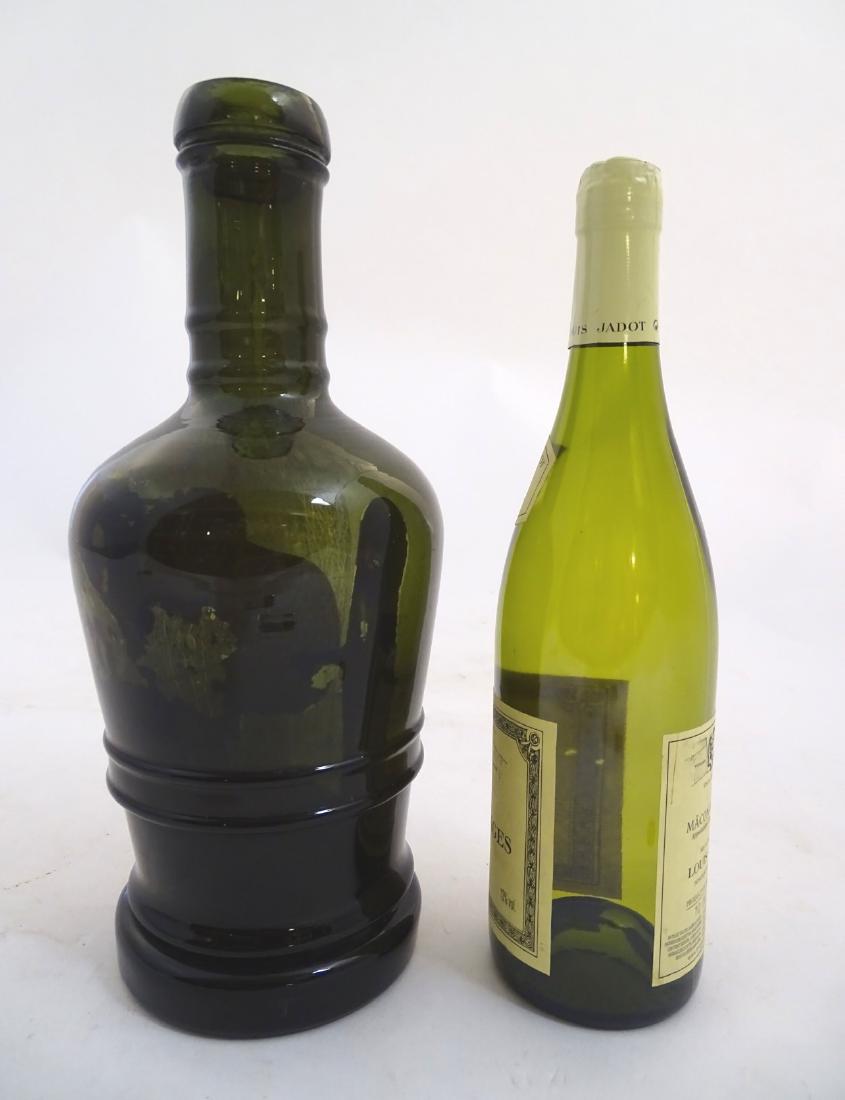 A large olive green bottle , circa 1820 , measuring 12: A large olive green bottle , circa 1820 , measuring 12 3/4'' high x 4 5/8'' diameter of base