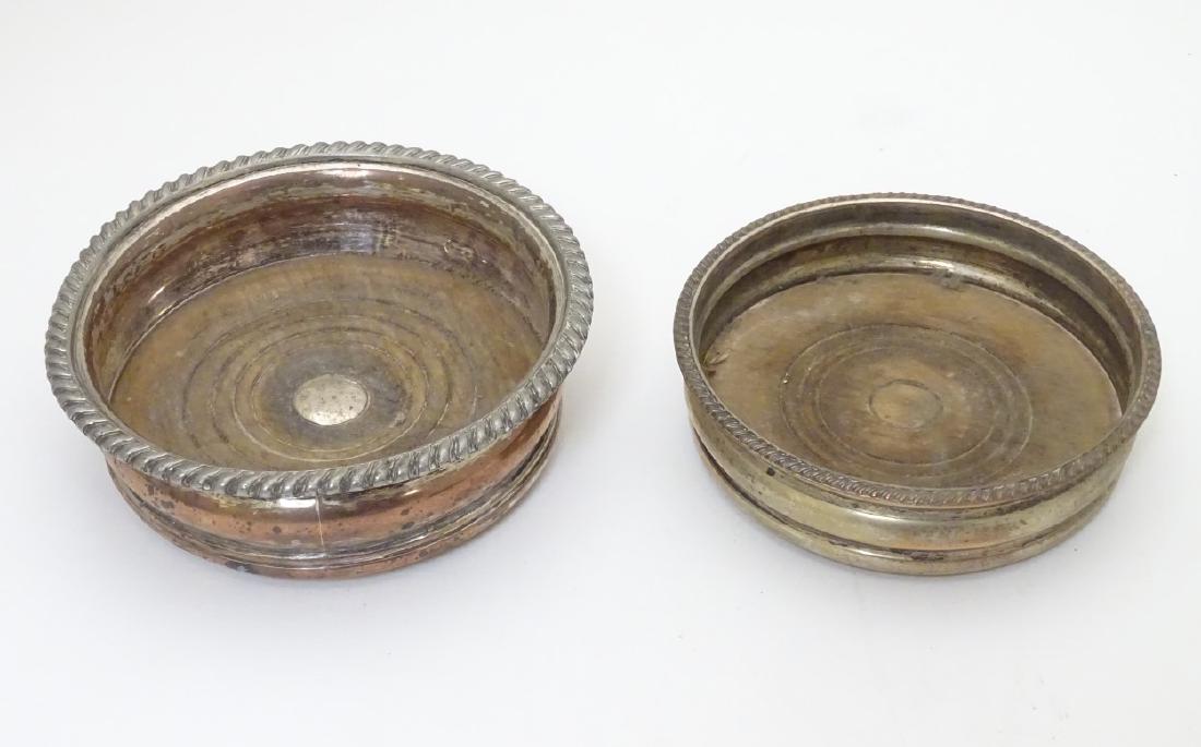 2 silver plate bottle coasters. The largest 6'': 2 silver plate bottle coasters. The largest 6'' diameter