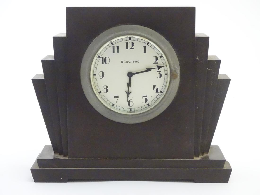 An Art Deco Bakelite case 'Electric' Swiss Made mantle: An Art Deco Bakelite case 'Electric' Swiss Made mantle clock 6 1/8'' high