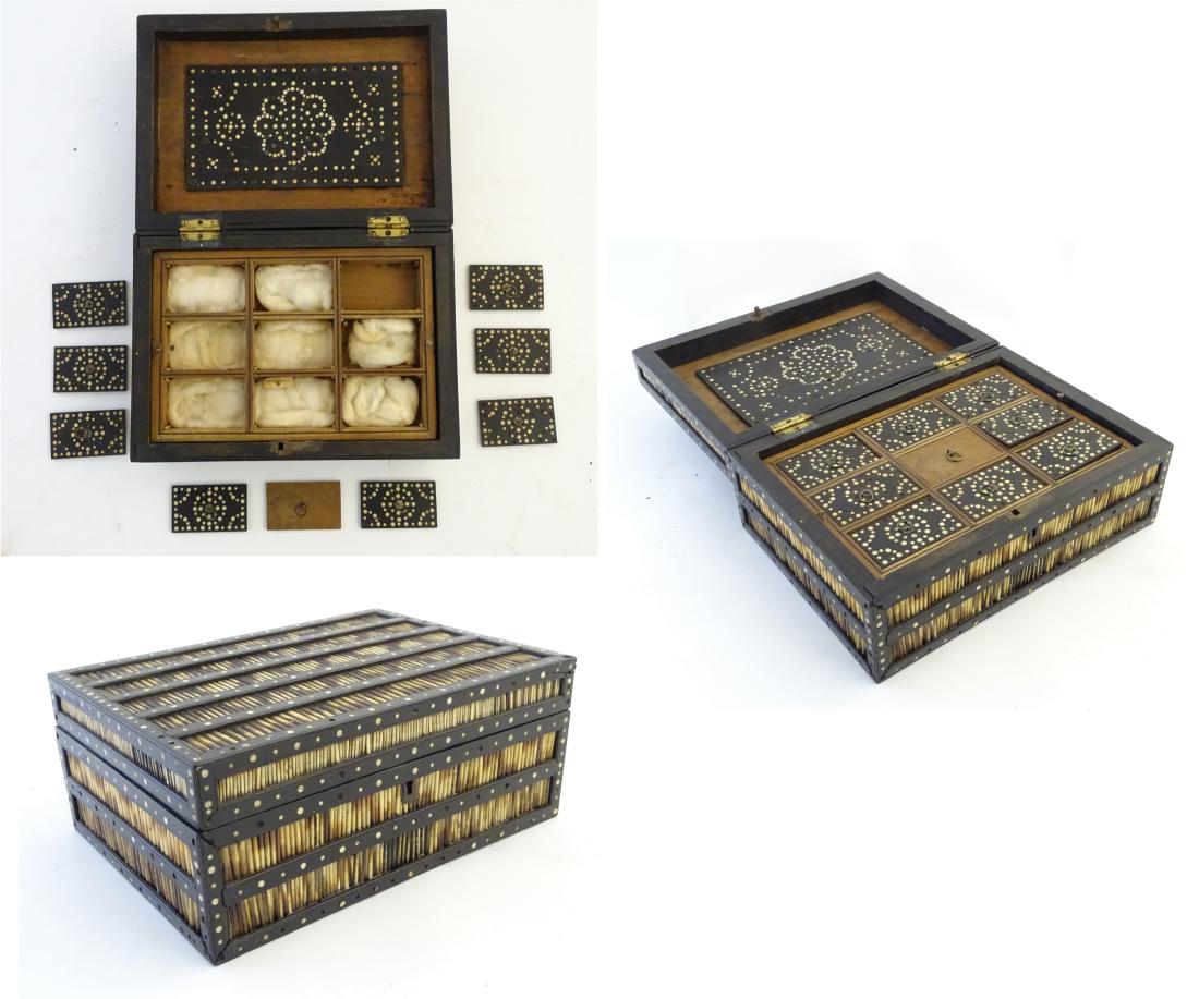 Quill box: a 19thC Ceylonese quill box with a lift out: Quill box: a 19thC Ceylonese quill box with a lift out sectional lidded tray, ebony banding and bone dot inlay, sandalwood body and quill decoration, 11 7/8'' wide.