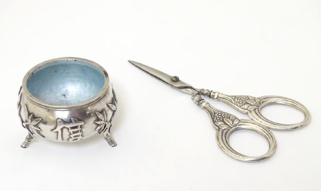 A Chinese export silver salt with bamboo and Chinese: A Chinese export silver salt with bamboo and Chinese character mark decoration, marked under, together with a pair of Continental white metal handled scissors 4 1/4'' long