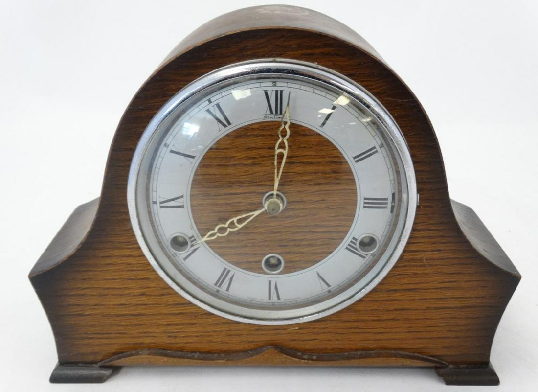 3 Train Oak Mantle Clock : a 'Perivale ' oak cased 3: 3 Train Oak Mantle Clock : a 'Perivale ' oak cased 3 train Westminster Chime oak cased mantle clock with ' Strike - Silent ' at 3 , ' Bentima ' Chapter ring with Roman numerals measuring 11 1/2'' wide