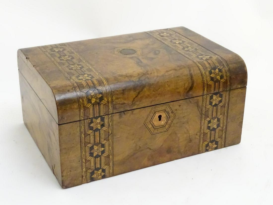 A mid - late 19thC ladies workbox of semi- domed form: A mid - late 19thC ladies workbox of semi- domed form with banded and hexagonal inlay opening to reveal a lift out tray,11 3/4'' wide x 8 5/8'' deep x 5 5/8'' high.