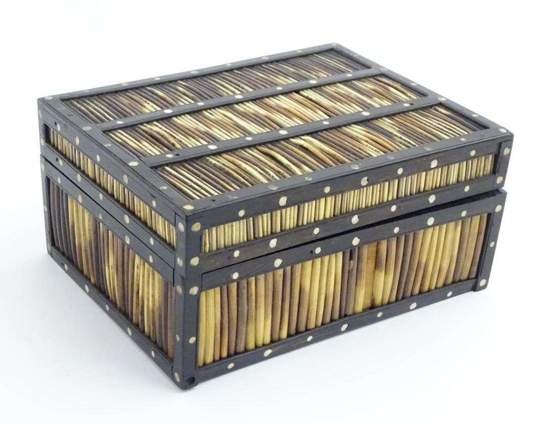 A c.1950 porcupine quill box with ebony banding and: A c.1950 porcupine quill box with ebony banding and bone inlay. 7 3/4'' x 6'' x 3 5/8''