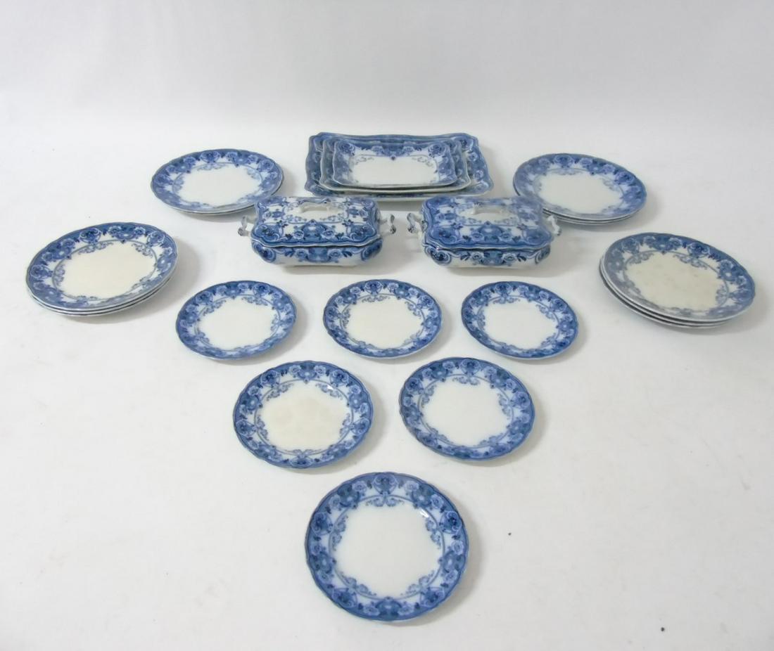 An early 20thC Ford & Sons Burslem Flow Blue and white: An early 20thC Ford & Sons Burslem Flow Blue and white dinner service in Devon pattern including dinner plates, salad plates, tureens, side plates and serving/platter dishes, makers mark to base, larg