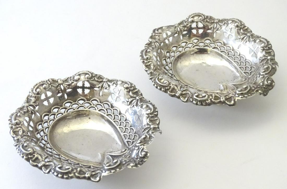 A pair of silver bon bon dishes hallmarked Chester 1897: A pair of silver bon bon dishes hallmarked Chester 1897 maker Daniel George Collins. 4 3/4'' long